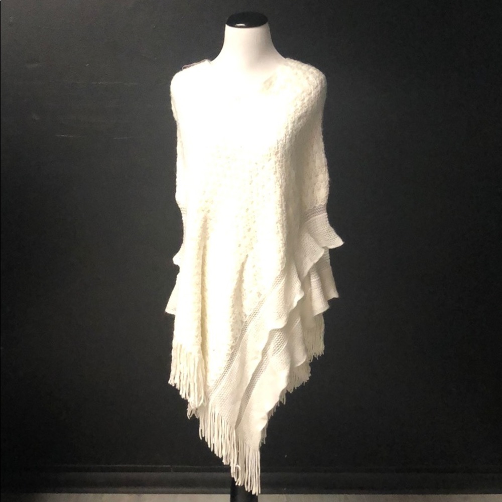 White acrylic frilled poncho with fringe